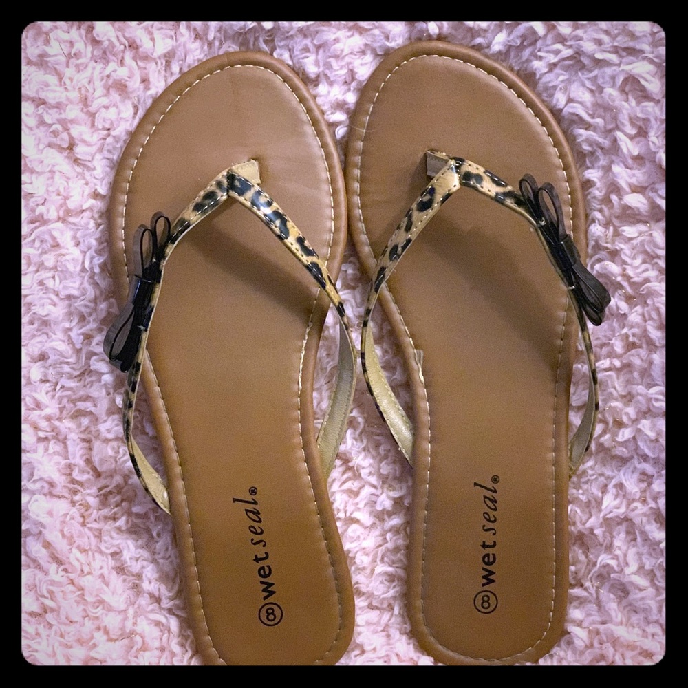 Cheetah print flip flops with black bows